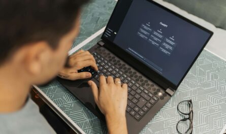 A product designer using AI tools on laptop for UI/UX design in 2025