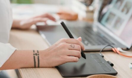 Designer creating AI-powered moodboard on laptop