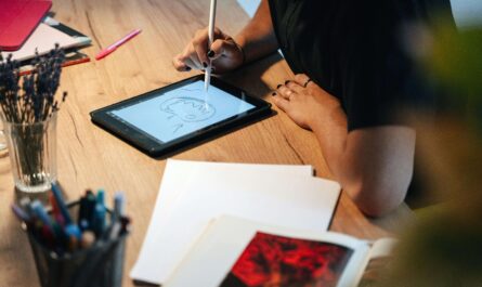 Product designer working in Sketch app with an AI plugin panel open on laptop screen.