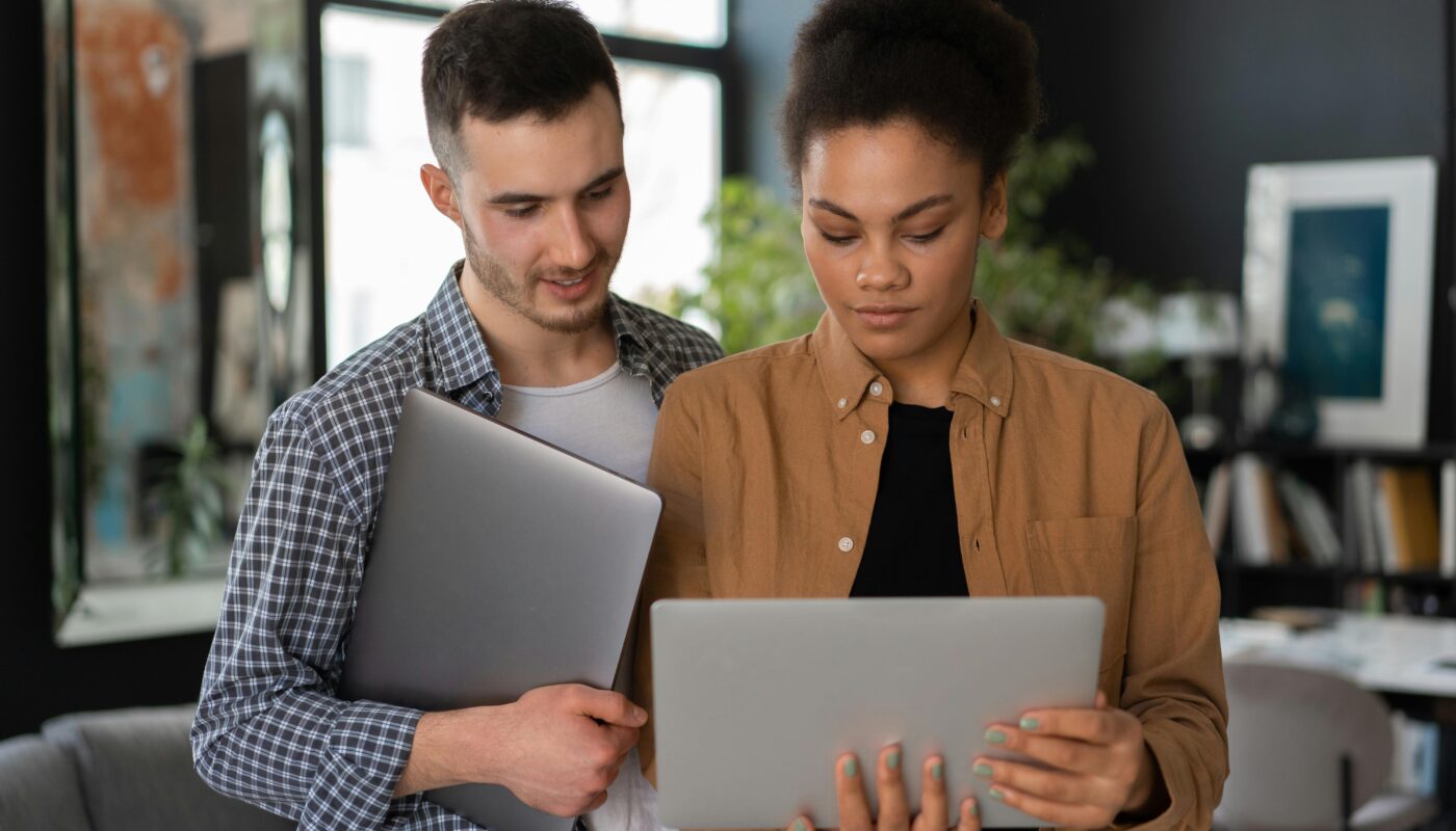 Entrepreneur validating product concept using AI dashboard on laptop