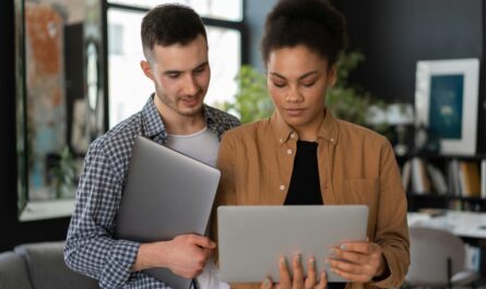 Entrepreneur validating product concept using AI dashboard on laptop