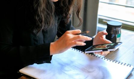 Person scanning a paper sketch to turn it into a digital prototype using AI