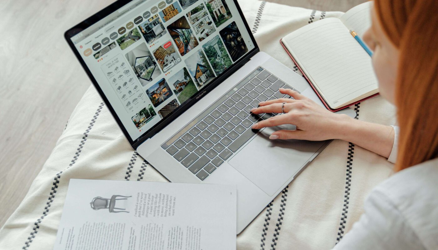 Freelancer using AI landing page builder on laptop with drag-and-drop blocks and CTA section