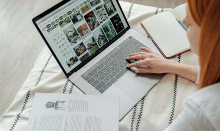 Freelancer using AI landing page builder on laptop with drag-and-drop blocks and CTA section